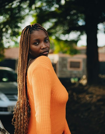 Long braids with orange styling